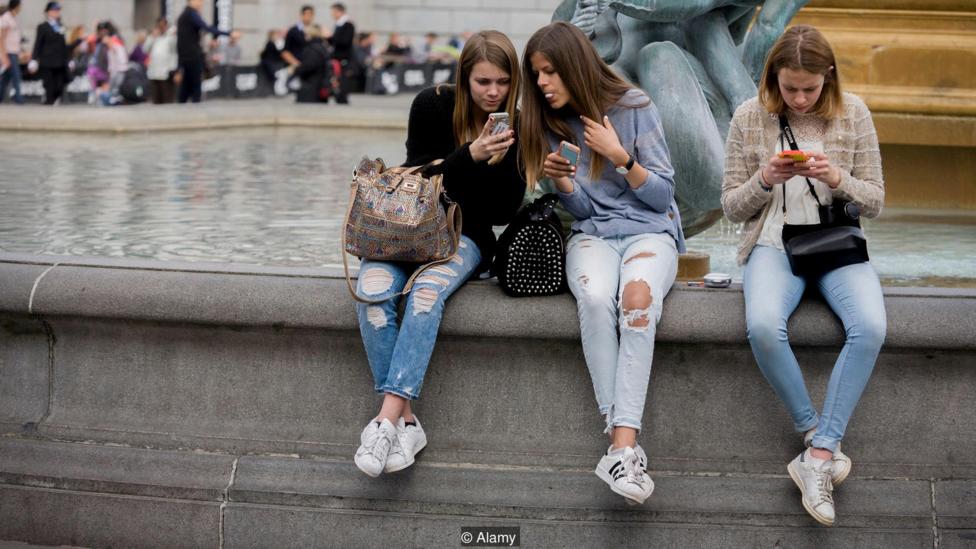 teenage girls with smartphone
